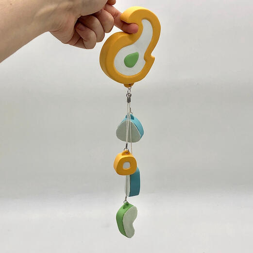 "Fidget", Resin 3D Print, Acrylic Paint, Dyed Fabric, Cotton Cord, Bells, 13.75” x 3.75” x .625”, 2023
